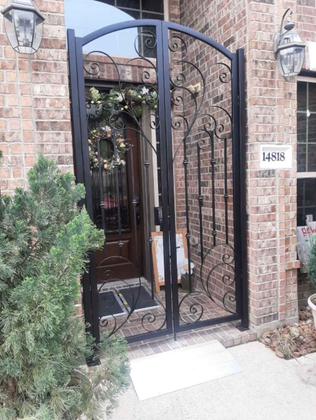 Wrought iron courtyard gate with scrollwork