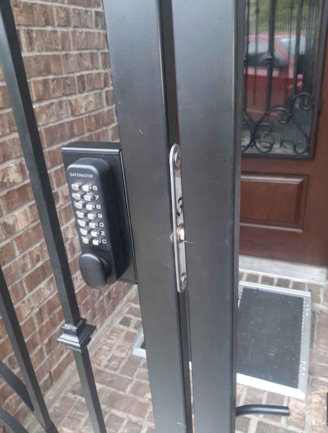 Keypad lock on a steel courtyard gate